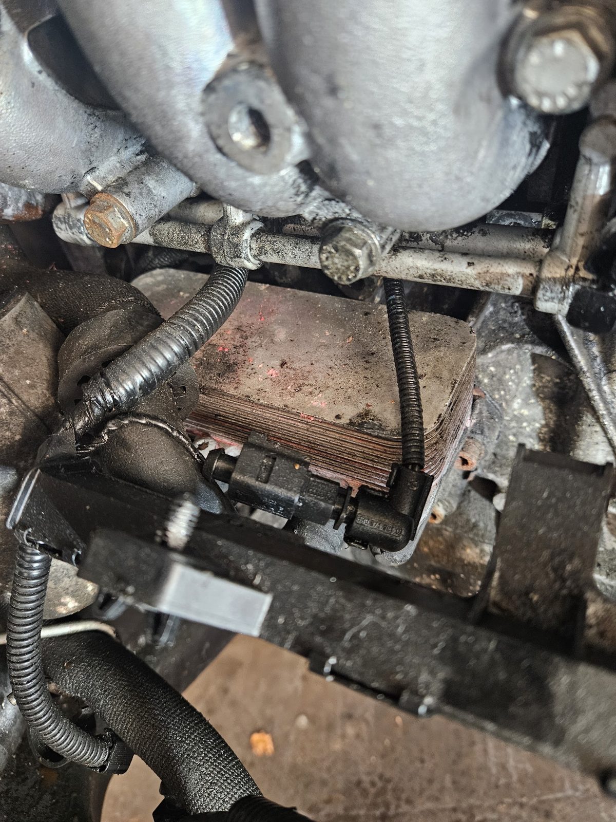Under the bonnet during a repair at Hi-Tech Garage