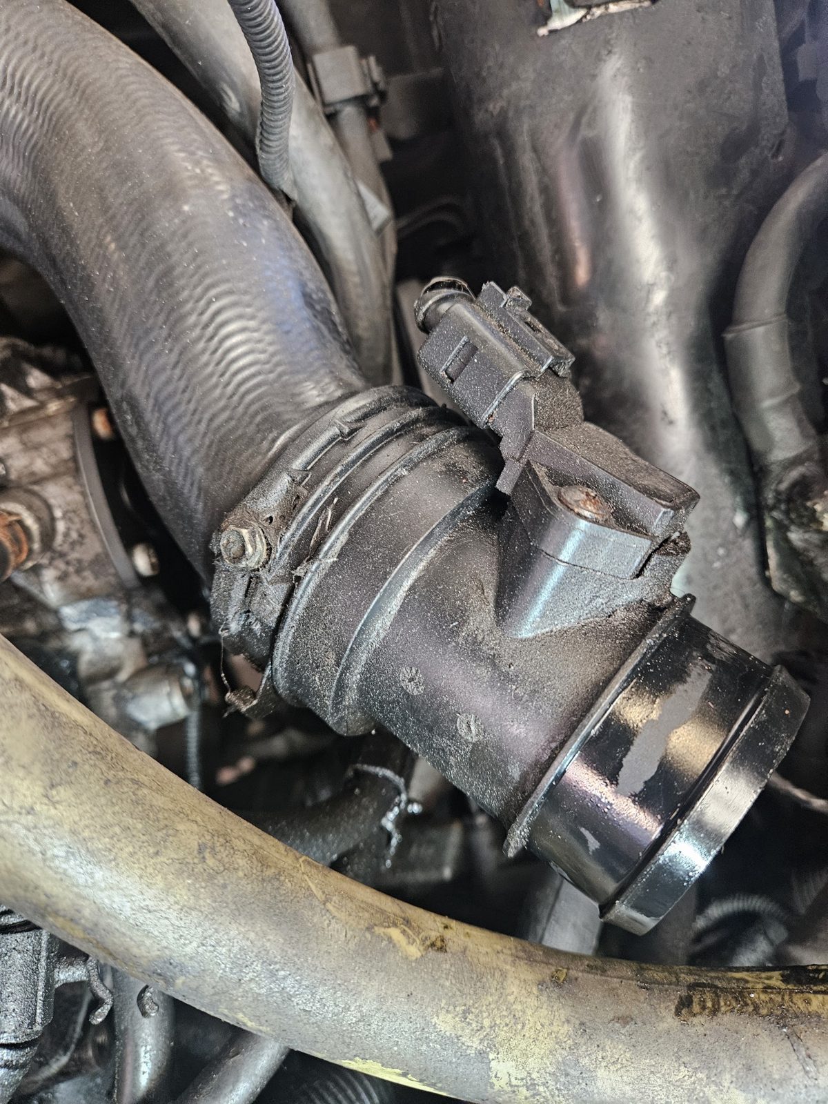 Engine bay pipework during a repair